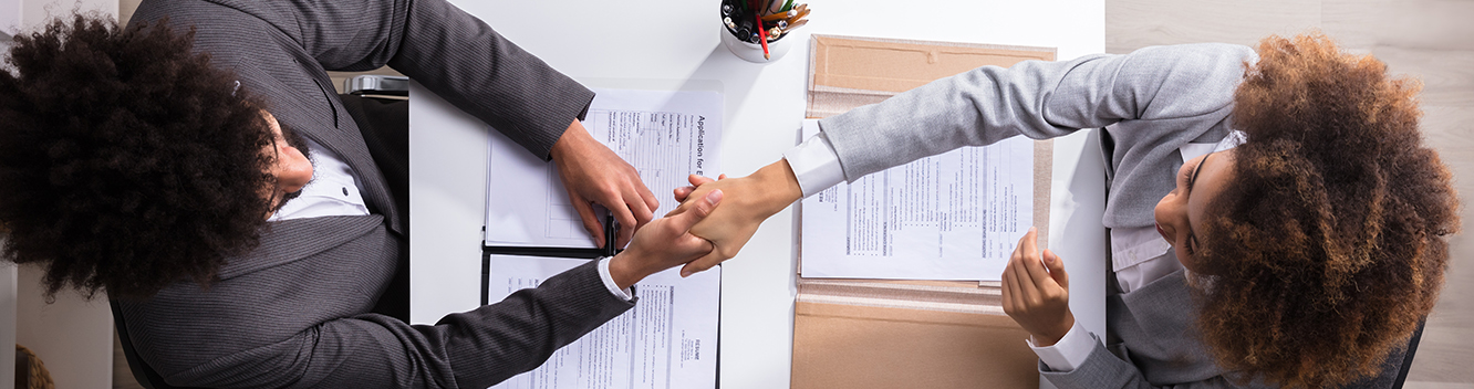 overhead view of people shaking hands