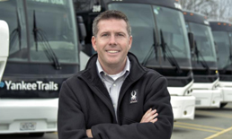 man standing in front of buses
