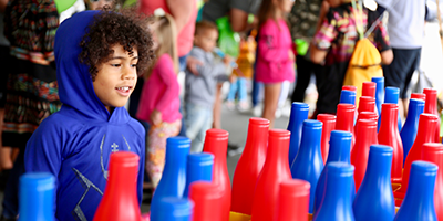 child playing carnival games