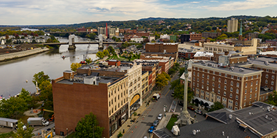 image of buildings by a river