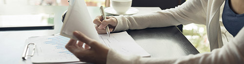 Woman reviewing financial statements.