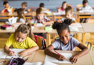 students sitting at desks in a classroom