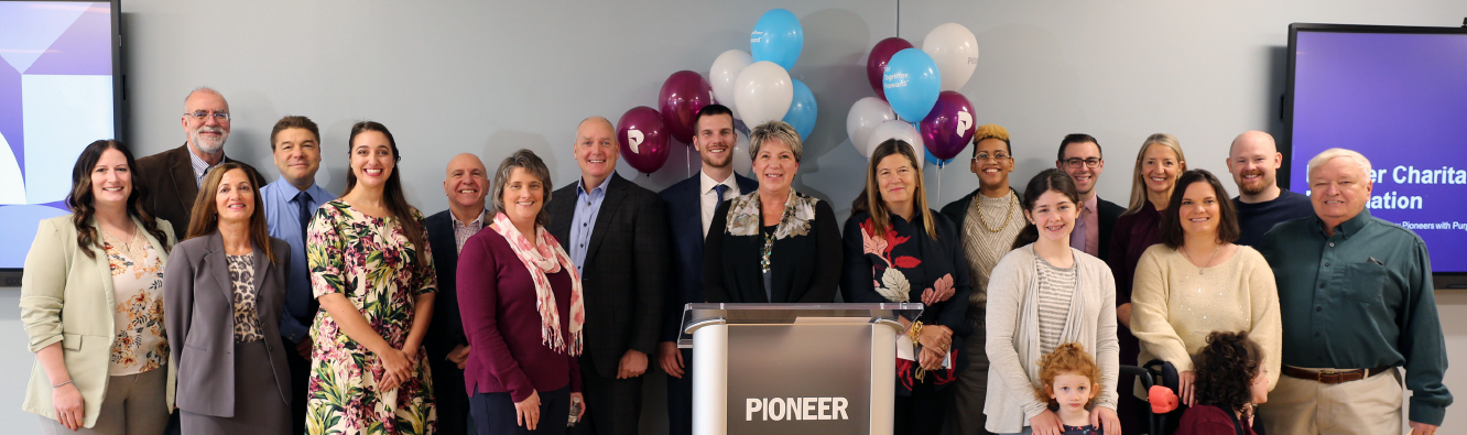 Pioneer employees and local non-profit leaders celebrating Giving Tuesday at Pioneer HQ.