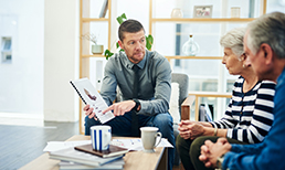 Couple meeting with a financial advisor.