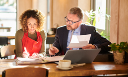 Small business owner meeting with a financial consultant.