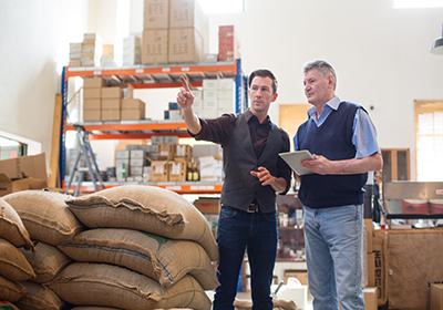 two men looking at store room