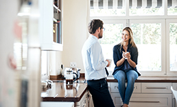 couple in kitchen talking