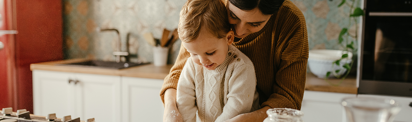 Mother and son baking.