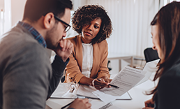 Couple meeting with a financial advisor.