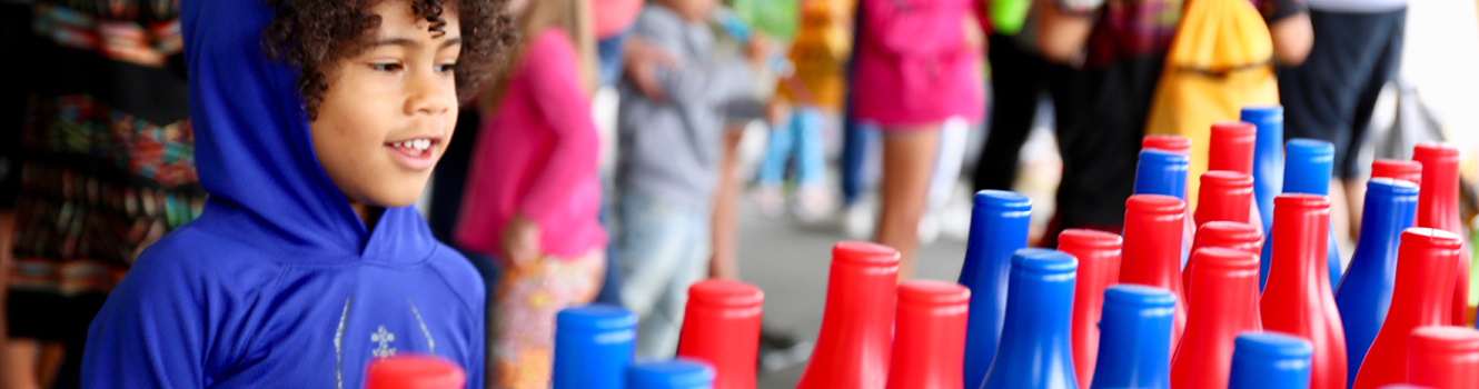 child playing carnival games