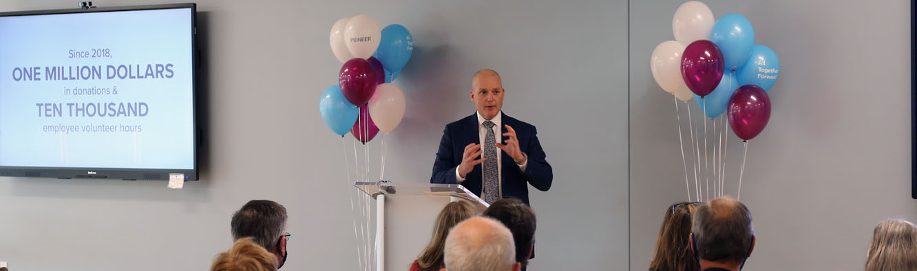 man speaking in front of an audience