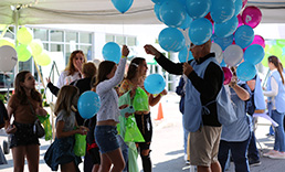 Thomas Signor - EVP & Chief Administrative Officer handing out balloons at Pioneer Grand Carnival