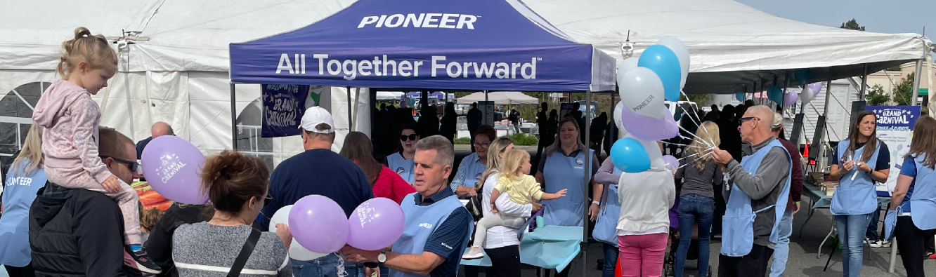 Pioneer Grand Carnival check in tent with attendees