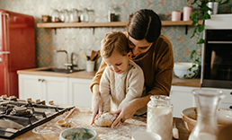 Mother and son baking.