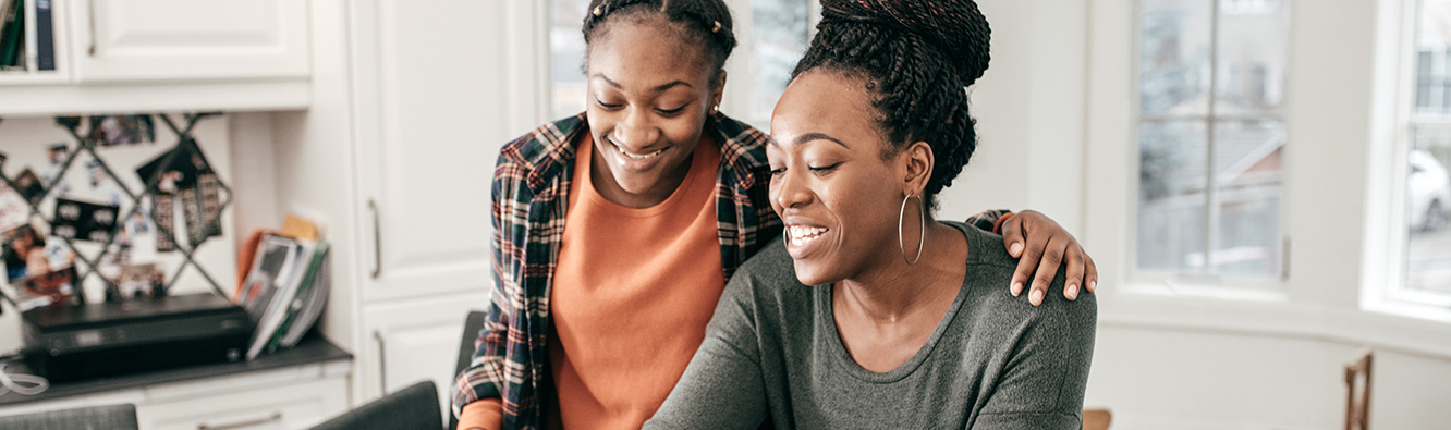 woman and teenager smiling