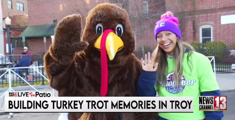 Trotter, the Troy Turkey Trot Mascot with caption "Building Turkey Trot Memories In Troy"