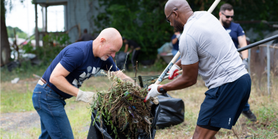 Pioneer employees volunteering, yard work