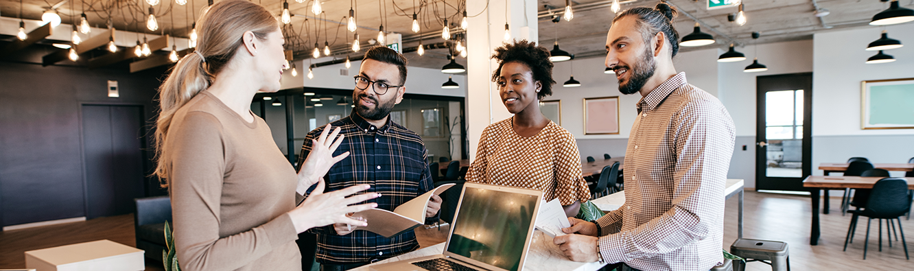 people talking in front of a computer