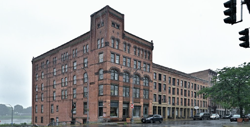 This new $67 million seven-story mixed-use building nearby at 150 River St. is part of the redeveloped John P. Taylor Apartments, a public housing complex.