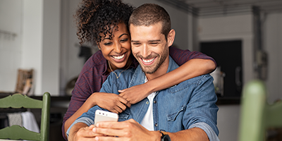 couple looking at mobile device