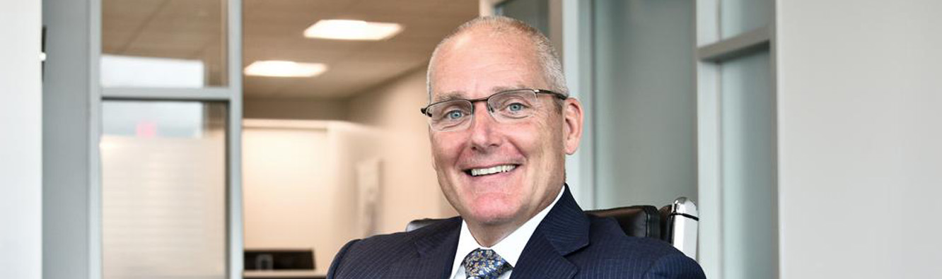 Man smiling at desk