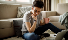 Woman drinking coffee at home