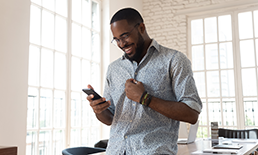 man looking at mobile device