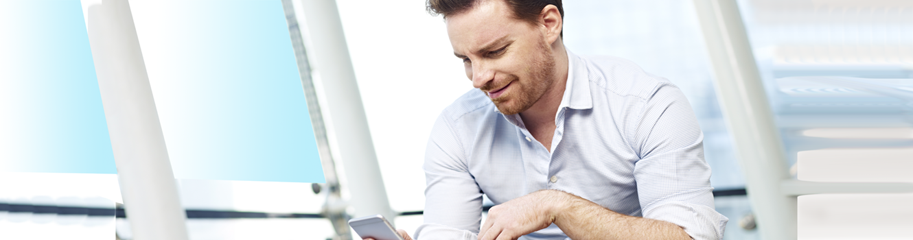 Man checking phone bewildered