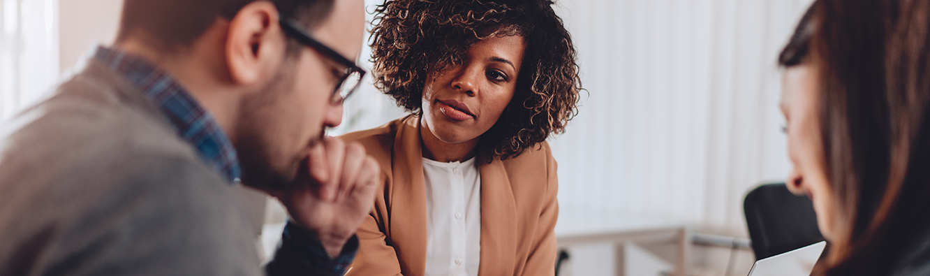 Couple meeting with a financial advisor.