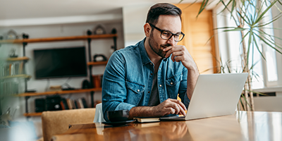 man looking at laptop