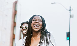 Young adult couple walking in the city.