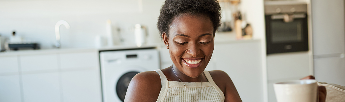 woman smiling in a kitchen