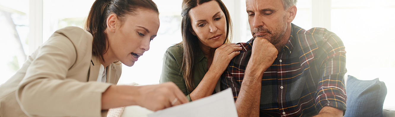 people looking over paperwork