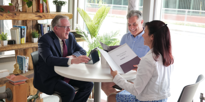 Couple meeting with a Pioneer Wealth Consultant