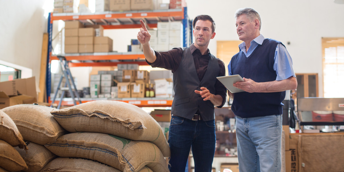 men looking in store room