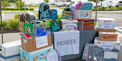 School supply drive donation pile of supplies